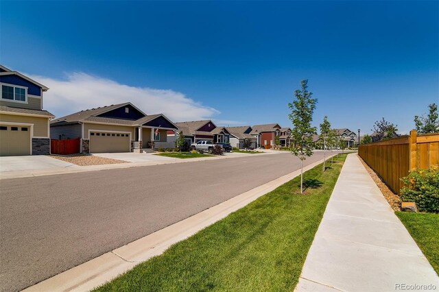view of road with sidewalks and a residential view