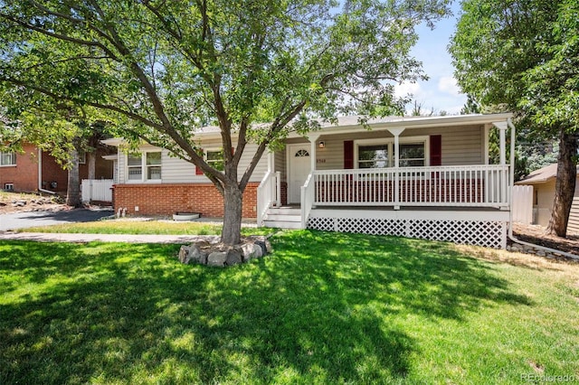 6749 S Foresthill St, Littleton, CO 80120 - view of front facade with a porch, a front yard, and brick siding