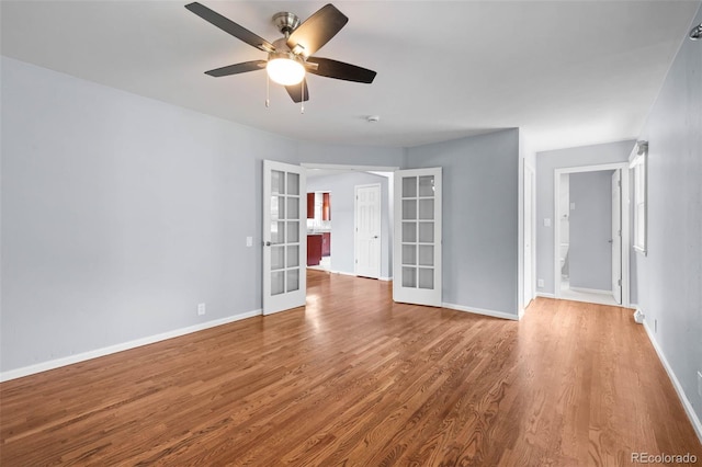 6749 S Foresthill St, Littleton, CO 80120 - unfurnished room with french doors, wood finished floors, and a ceiling fan