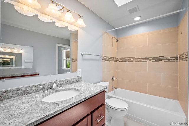 6749 S Foresthill St, Littleton, CO 80120 - bathroom featuring vanity and shower / tub combination
