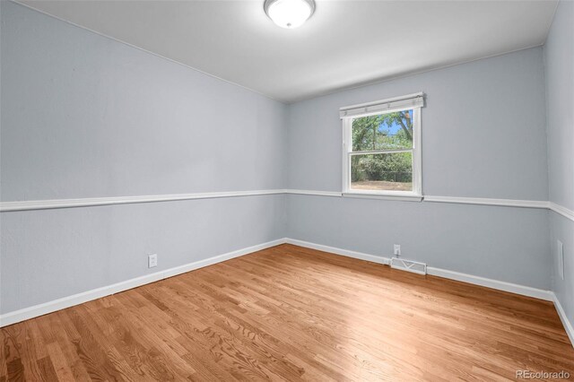 6749 S Foresthill St, Littleton, CO 80120 - empty room with wood finished floors