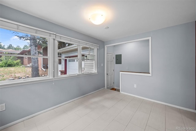 6749 S Foresthill St, Littleton, CO 80120 - spare room featuring baseboards and electric panel