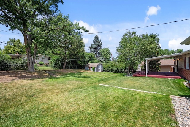 6749 S Foresthill St, Littleton, CO 80120 - view of grassy yard featuring a storage shed