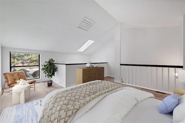 225 E 8th Ave Unit A2, Longmont, CO 80504 - bedroom with a skylight, wood finished floors, lofted ceiling, and baseboards