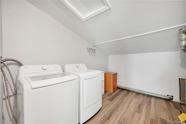 225 E 8th Ave Unit A2, Longmont, CO 80504 - laundry room featuring washer and dryer and light wood-style flooring