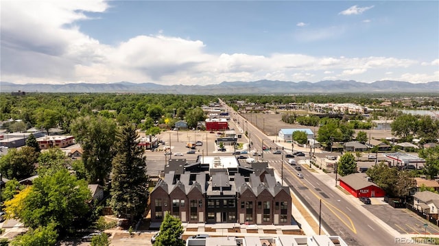 birds eye view of property with a mountain view