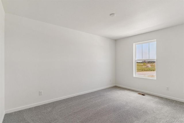 455 S Salida St, Aurora, CO 80017 - carpeted empty room featuring baseboards