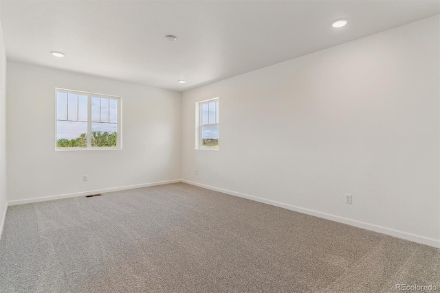 455 S Salida St, Aurora, CO 80017 - empty room featuring baseboards, carpet flooring, and recessed lighting