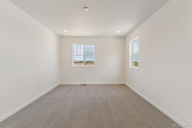 455 S Salida St, Aurora, CO 80017 - empty room with baseboards, light carpet, and recessed lighting