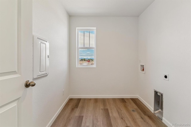 455 S Salida St, Aurora, CO 80017 - laundry area with electric dryer hookup, electric panel, light wood finished floors, and washer hookup