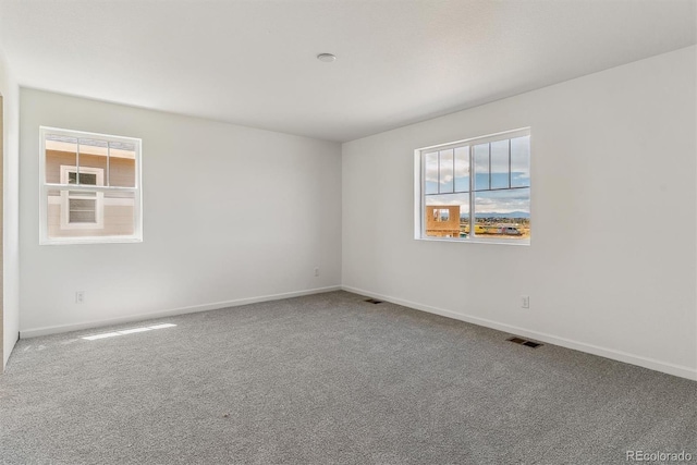 455 S Salida St, Aurora, CO 80017 - unfurnished room with plenty of natural light, carpet, and baseboards