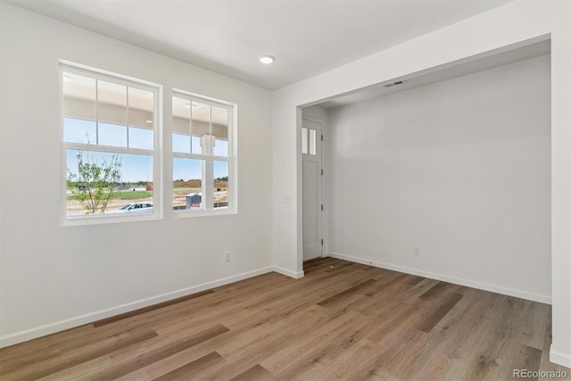 455 S Salida St, Aurora, CO 80017 - unfurnished room featuring plenty of natural light, light wood-style flooring, baseboards, and recessed lighting