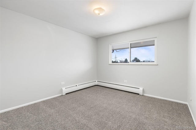 carpeted empty room with baseboard heating