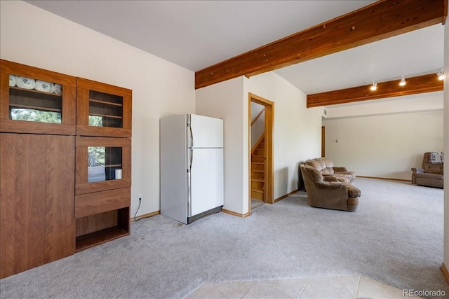 167 Wapiti Ct, Canon City, CO 81212 - living room featuring light carpet, beam ceiling, stairs, and baseboards