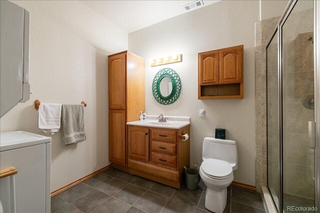 167 Wapiti Ct, Canon City, CO 81212 - full bath with a shower stall, toilet, tile patterned floors, and vanity