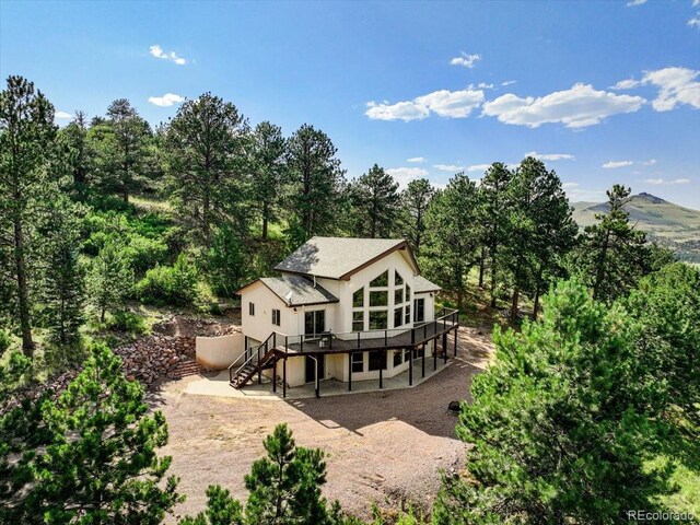 167 Wapiti Ct, Canon City, CO 81212 - back of house featuring stairs, a wooden deck, and a patio area