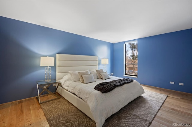 bedroom featuring wood finished floors