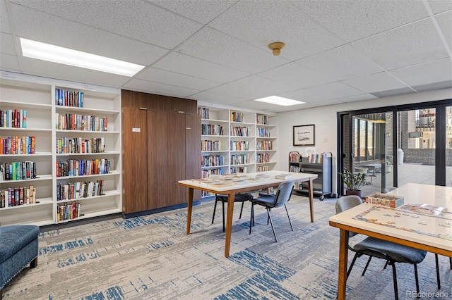 home office featuring wall of books