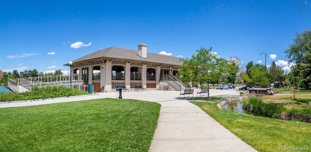 view of community featuring a yard and a patio