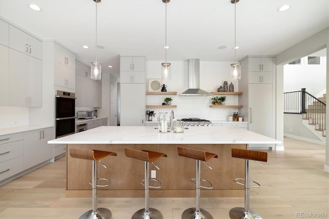 2221 Rim Ridge Dr, Castle Pines, CO 80108 - kitchen featuring wall chimney exhaust hood, open shelves, decorative backsplash, recessed lighting, and modern cabinets