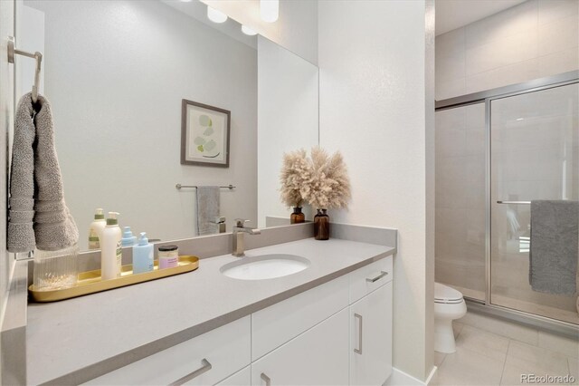 2221 Rim Ridge Dr, Castle Pines, CO 80108 - full bath featuring vanity, a shower stall, and tile patterned floors