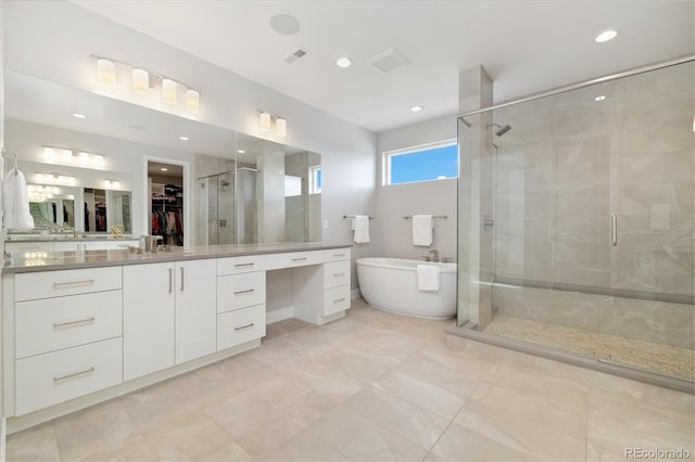 2221 Rim Ridge Dr, Castle Pines, CO 80108 - full bath featuring vanity, a spacious closet, a shower stall, a freestanding bath, and recessed lighting