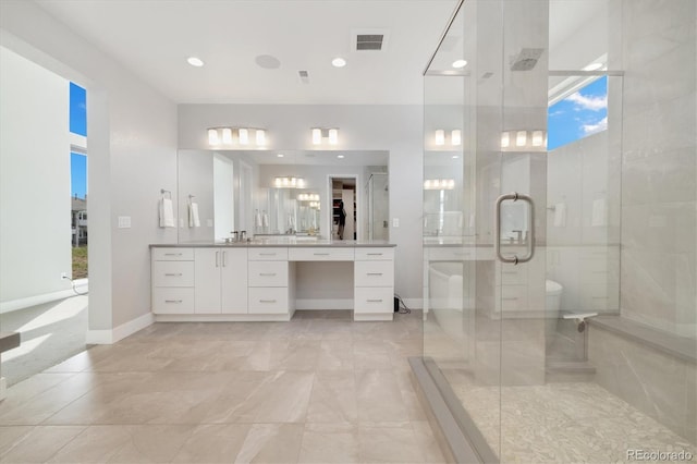 2221 Rim Ridge Dr, Castle Pines, CO 80108 - full bathroom featuring vanity, a shower stall, recessed lighting, a freestanding tub, and a spacious closet