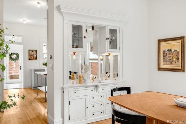 interior space with baseboards and wood-type flooring