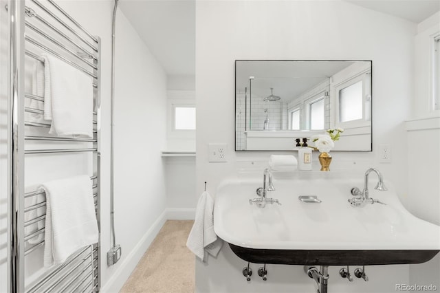 bathroom with baseboards and a sink