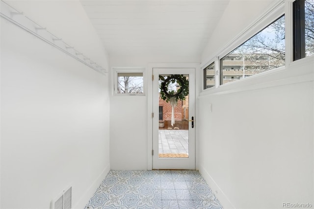 unfurnished sunroom with visible vents