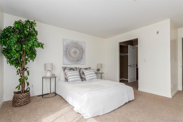 carpeted bedroom featuring baseboards