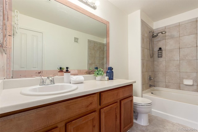 bathroom featuring shower / bathtub combination, toilet, vanity, and tile patterned floors