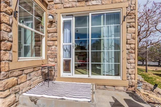 view of exterior entry with stone siding