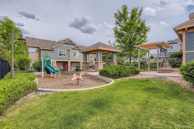 community playground with a pergola, a lawn, a gazebo, and fence