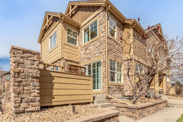 5722 S Addison Way Unit A, Aurora, CO 80016 - view of side of property with board and batten siding and stone siding