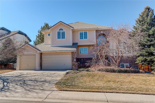 front of property featuring a garage and a front yard