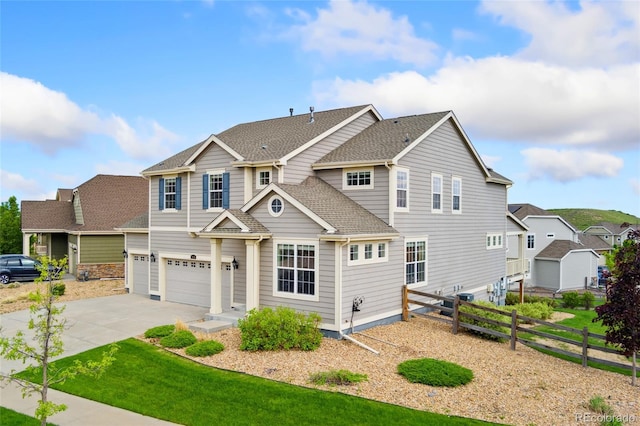 19316 W 84th Pl, Arvada, CO 80007 - view of front facade featuring an attached garage and driveway