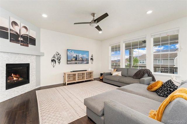 19316 W 84th Pl, Arvada, CO 80007 - living room featuring wood finished floors, a fireplace, ceiling fan, recessed lighting, and baseboards