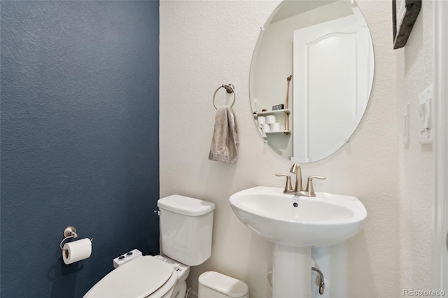 19316 W 84th Pl, Arvada, CO 80007 - half bathroom featuring toilet and a sink