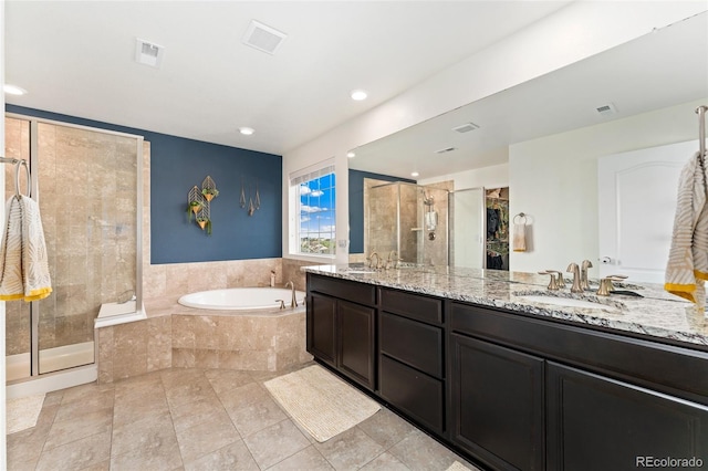 19316 W 84th Pl, Arvada, CO 80007 - full bath featuring a bath, a stall shower, double vanity, and recessed lighting