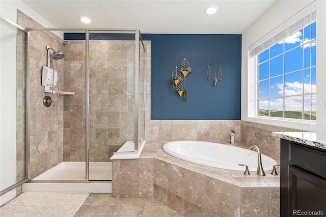 19316 W 84th Pl, Arvada, CO 80007 - full bathroom featuring a garden tub, a stall shower, vanity, and recessed lighting
