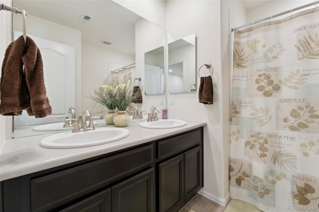 19316 W 84th Pl, Arvada, CO 80007 - full bathroom featuring double vanity and curtained shower
