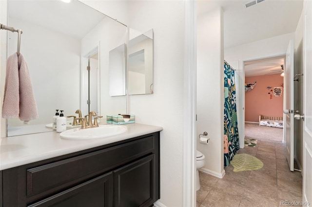19316 W 84th Pl, Arvada, CO 80007 - full bathroom featuring vanity, toilet, and tile patterned floors