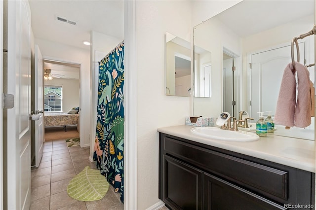 19316 W 84th Pl, Arvada, CO 80007 - ensuite bathroom featuring vanity, tile patterned floors, and a ceiling fan