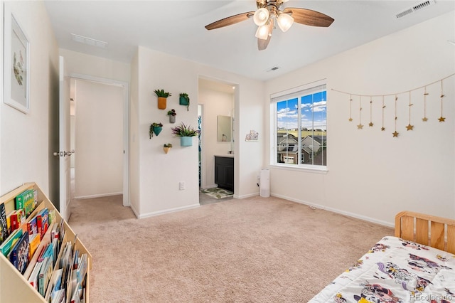 19316 W 84th Pl, Arvada, CO 80007 - bedroom featuring carpet flooring, baseboards, connected bathroom, and ceiling fan