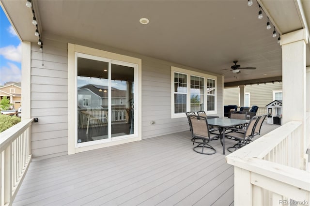 19316 W 84th Pl, Arvada, CO 80007 - wooden deck featuring outdoor dining space and a ceiling fan