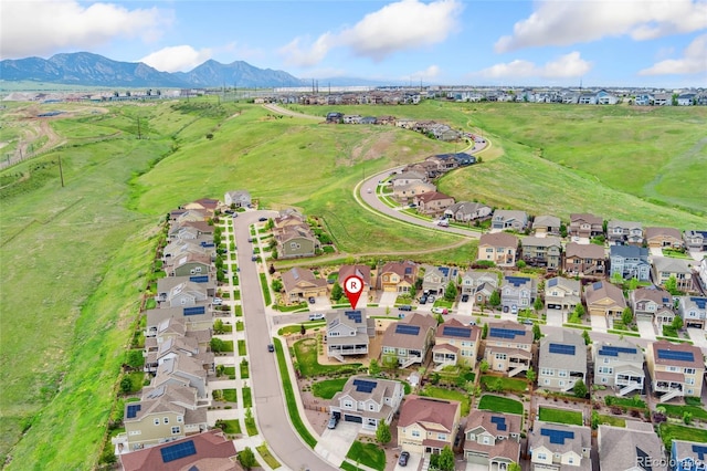 19316 W 84th Pl, Arvada, CO 80007 - aerial overview of property's location with a mountain backdrop and nearby suburban area