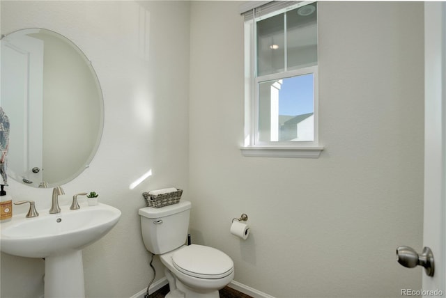 bathroom with toilet and sink