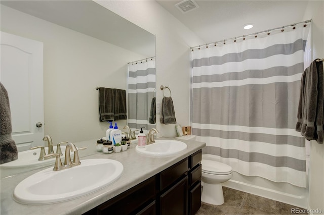 full bathroom featuring vanity, toilet, and shower / bath combo