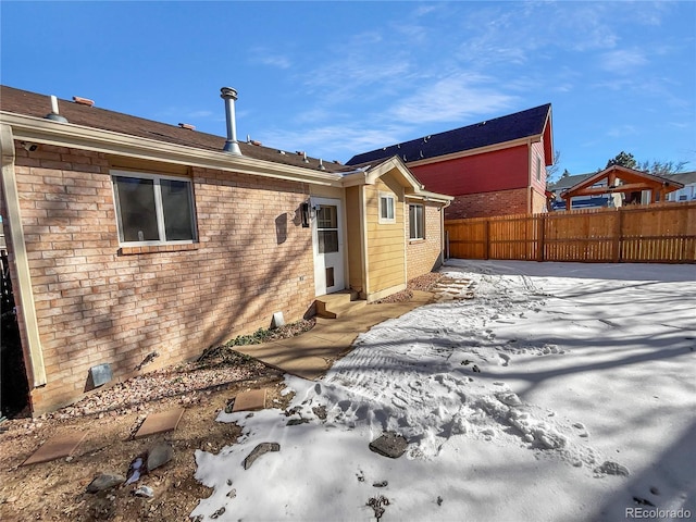 view of snow covered property